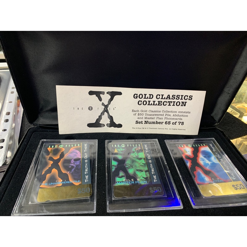 The X Files Gold Classic collection case old and warn phone cards